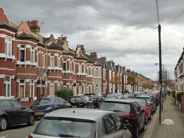 Terraced houses in Gaskarth Road on a narrow London street
